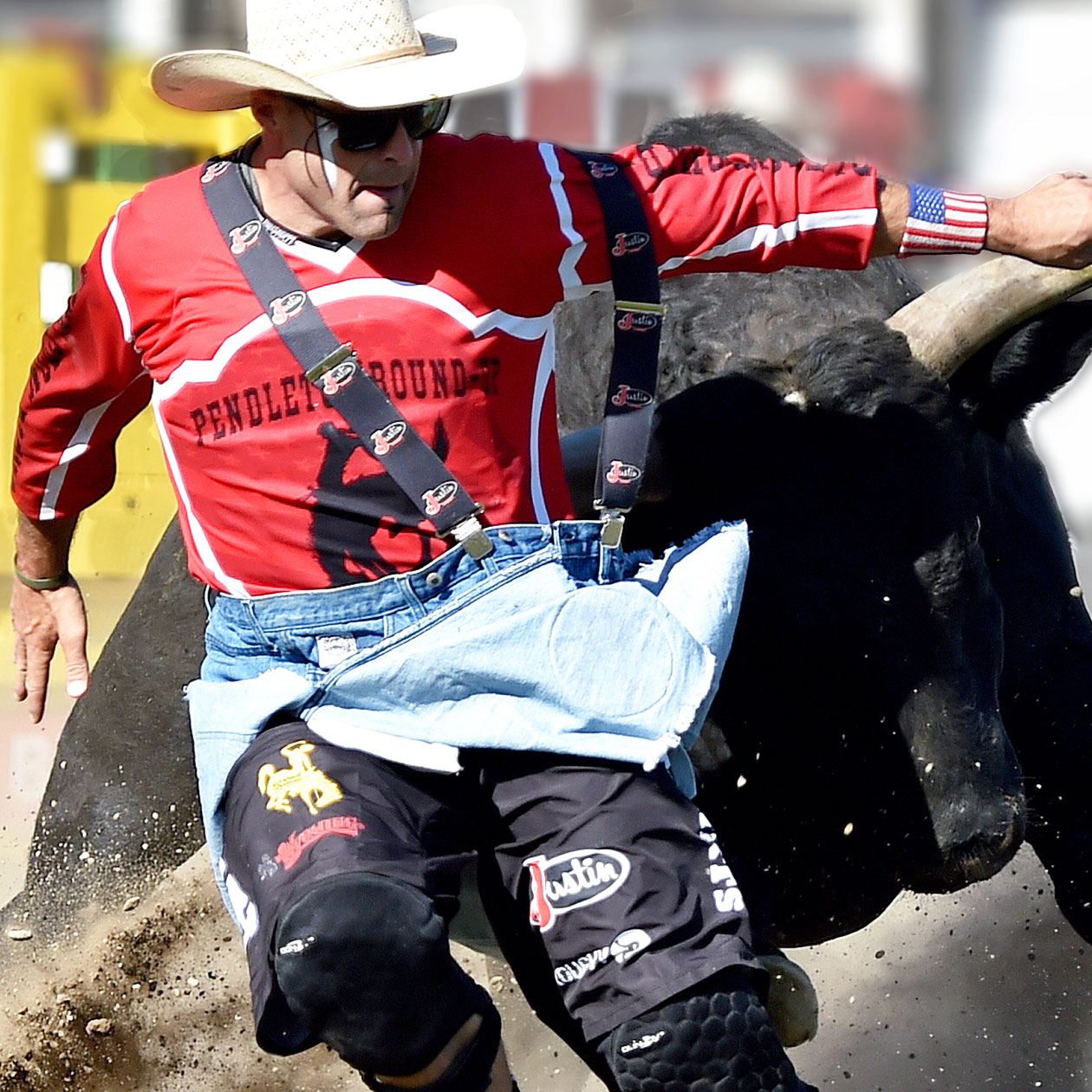 Man running in front of bull